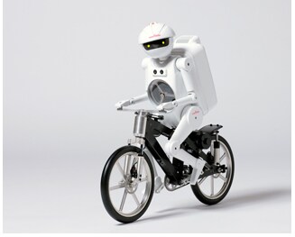 “图1：骑自行车的「村田顽童」机器人。（图源：Murata）”